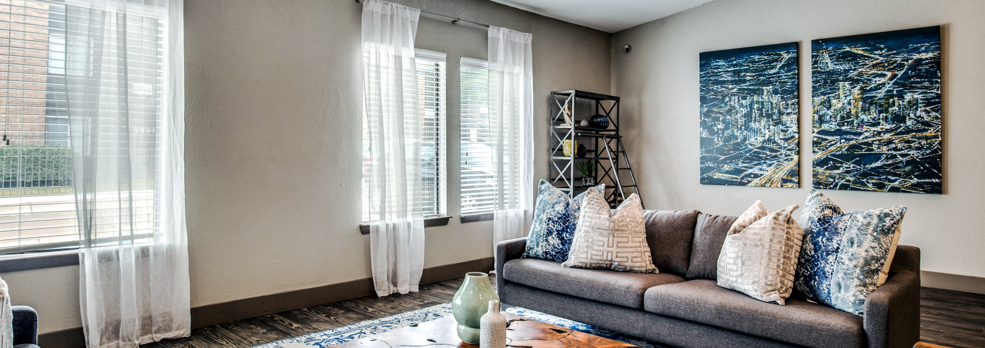 a living room with blue and white furniture at The  Mark at 2600