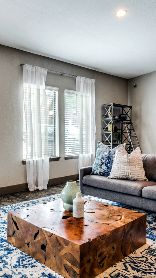 a living room with blue and white furniture at The  Mark at 2600