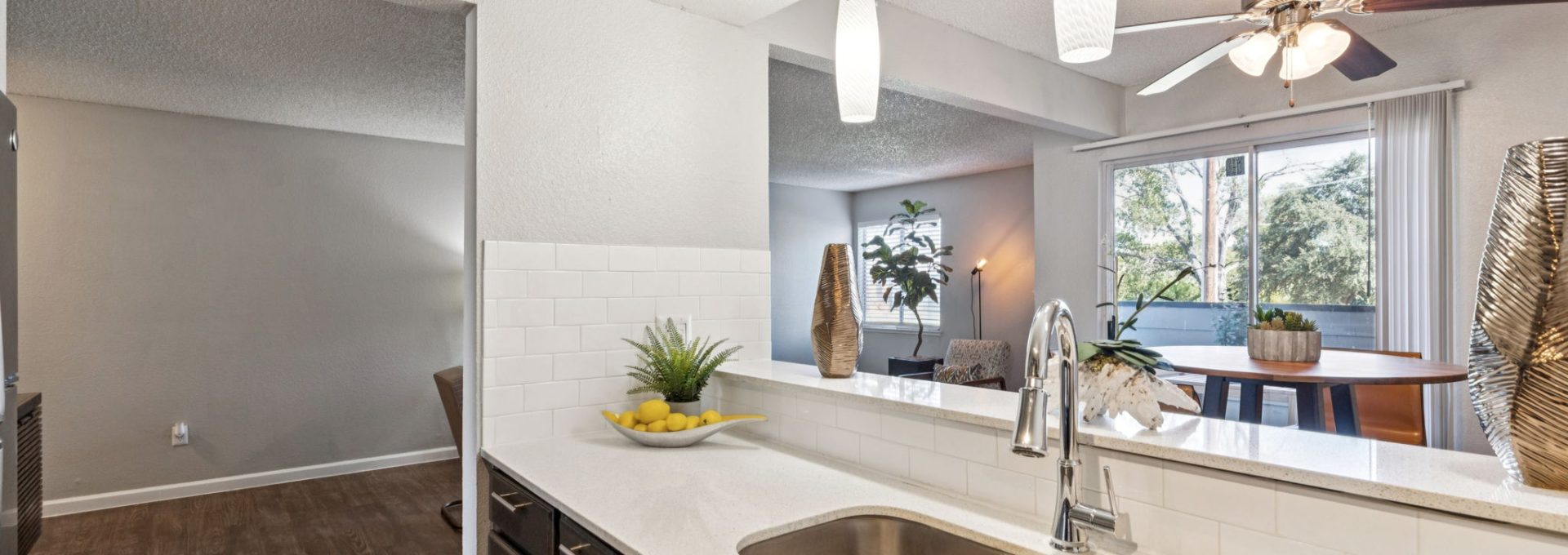 a kitchen with a sink and a window above it at The  Mark at 2600